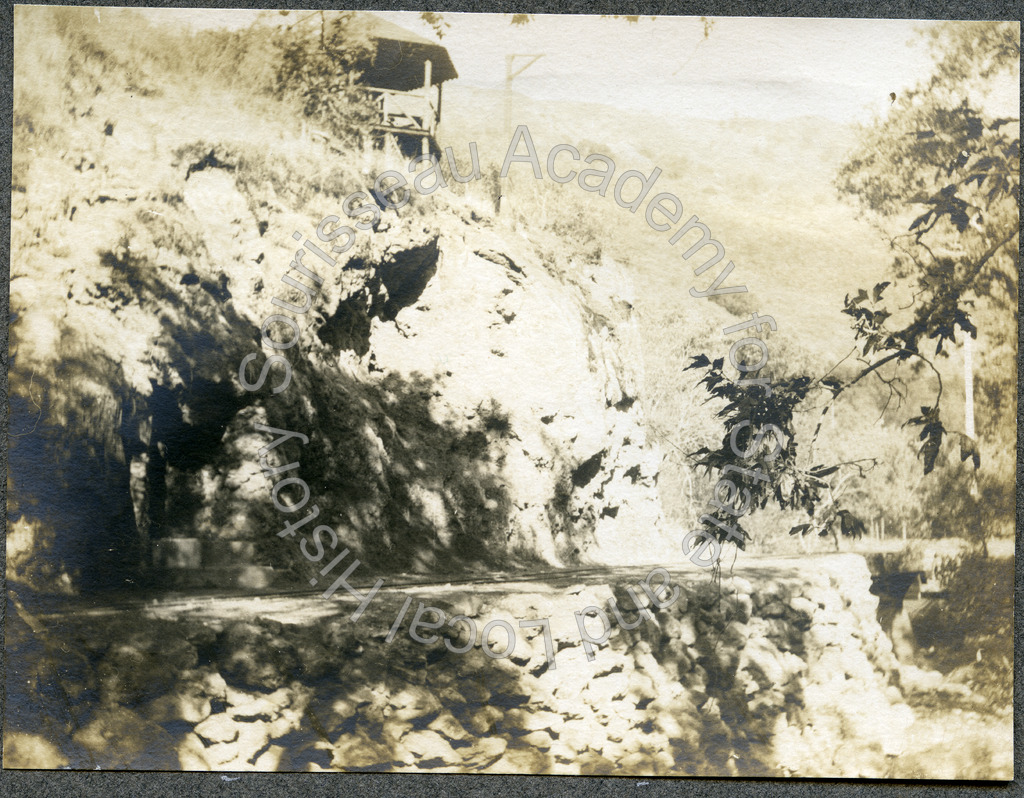 Railroad tracks, mineral spring enclosure, and cliff face, Alum Rock park