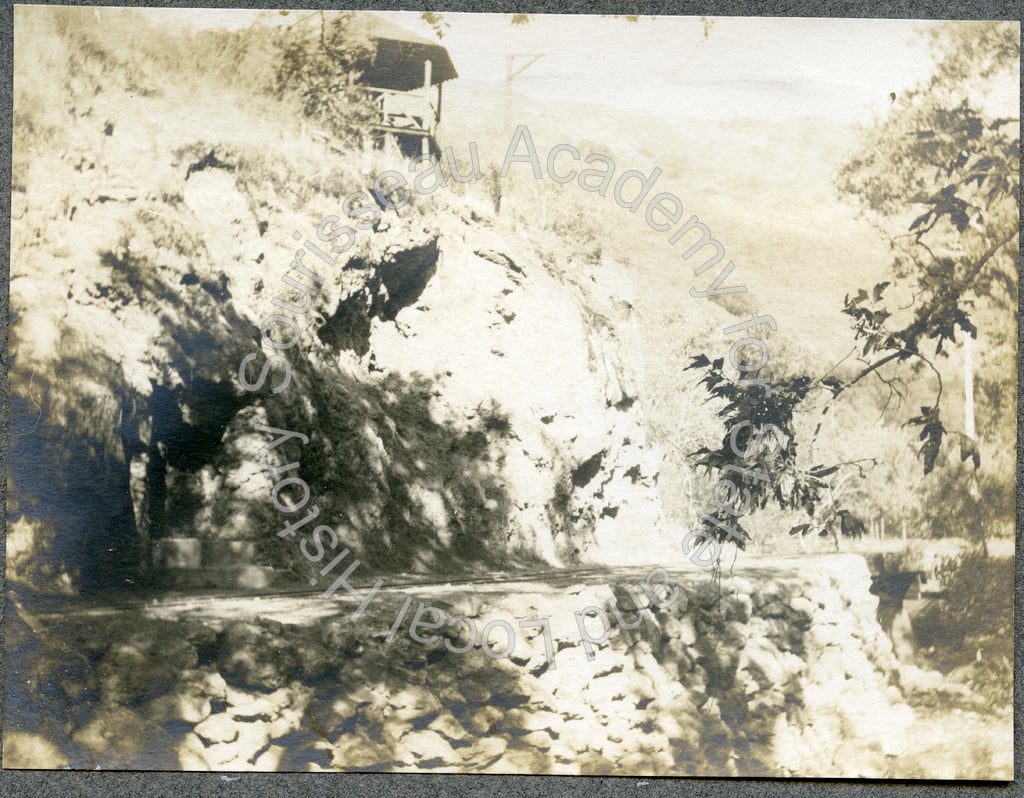 Railroad tracks, mineral spring enclosure, and cliff face, Alum Rock park