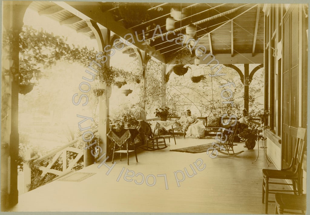 Mrs. E.W. Maynard sitting on porch of Alum Rock Cafe