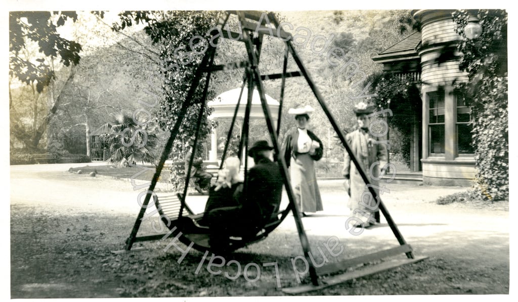 Man on swing and two women, Alum Rock Park