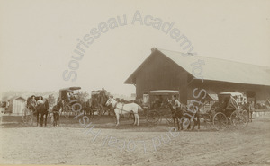 Image of Warehouse with horse and buggies in front