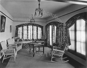 Image of Sunroom with wicker furniture and table