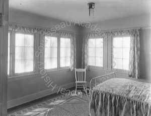 Image of Bedroom with a bed and chair