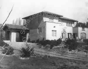 Image of Rear view of Wilson house with porte cochere and view of garden