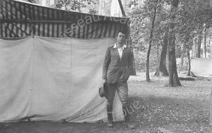 Image of Andrew P. HIll, Jr. standing next to a tent in the forest