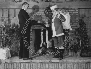 Image of Andrew P. Hill, Jr. and Santa Claus at Santa Maria Union High School