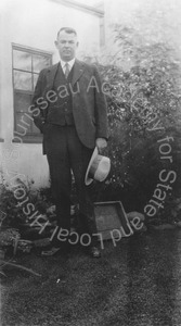 Image of Andrew P. Hill, Jr. standing in the yard