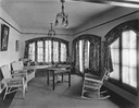 Image of Sunroom with wicker furniture and table