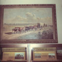 Image of "Crossing the Plains" framed canvas on wall