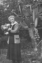 Image of Florence Watkins Hill standing next to a cactus plant in the yard