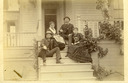 Image of Members of theTalbot and Walker families on the front steps of a home